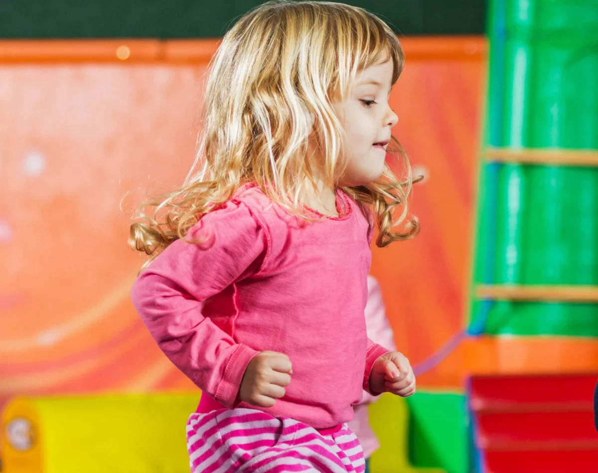 A little girl dancing at a Romp n' Roll focused activity class.