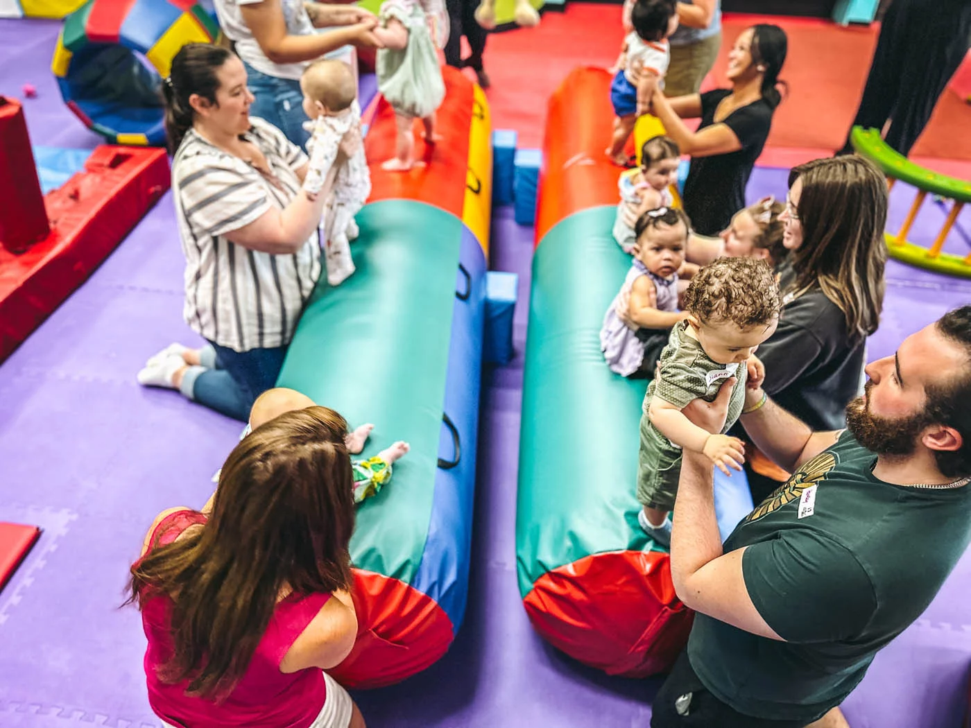 A group of kids and adults playing at Romp n' Roll.