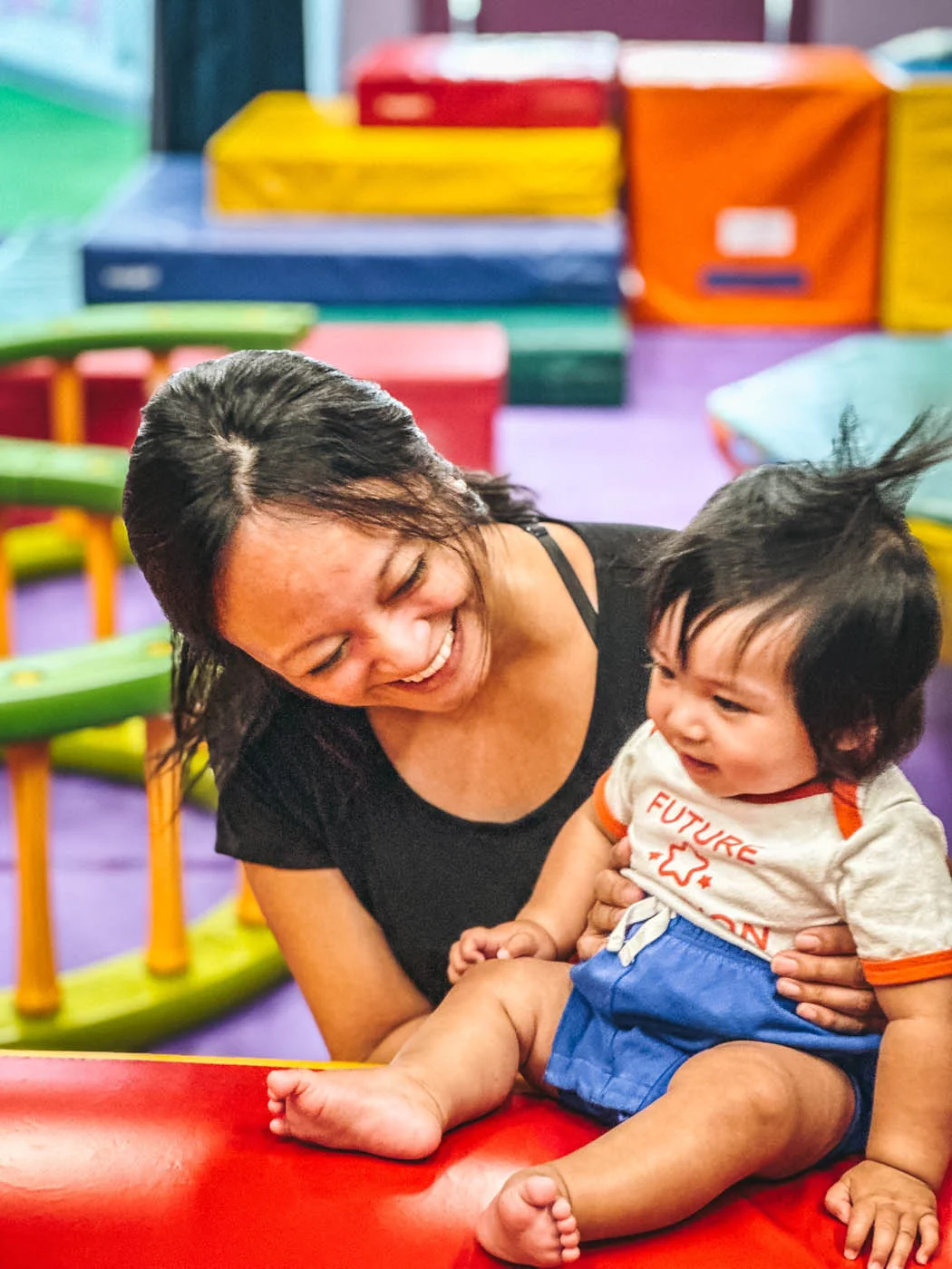 A mom and her kid at mommy and me classes.