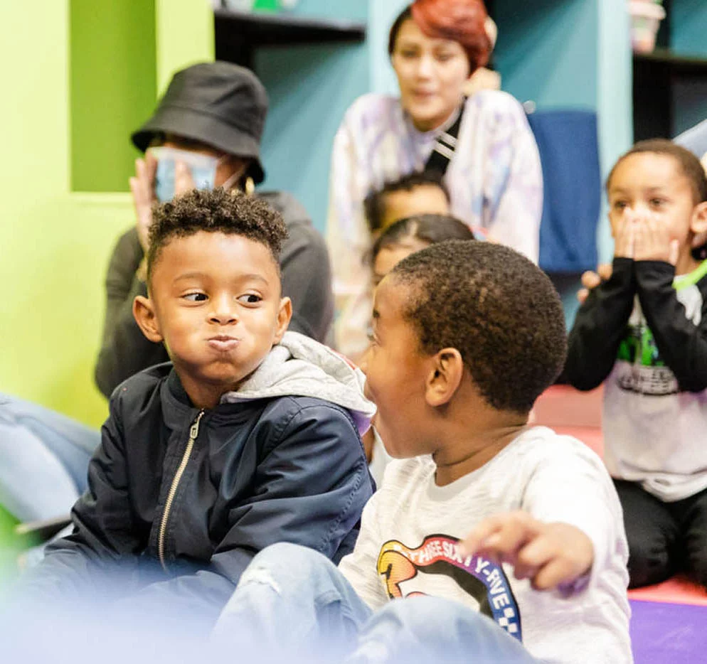 Kids laughing at a birthday party hosted by Romp n' Roll.