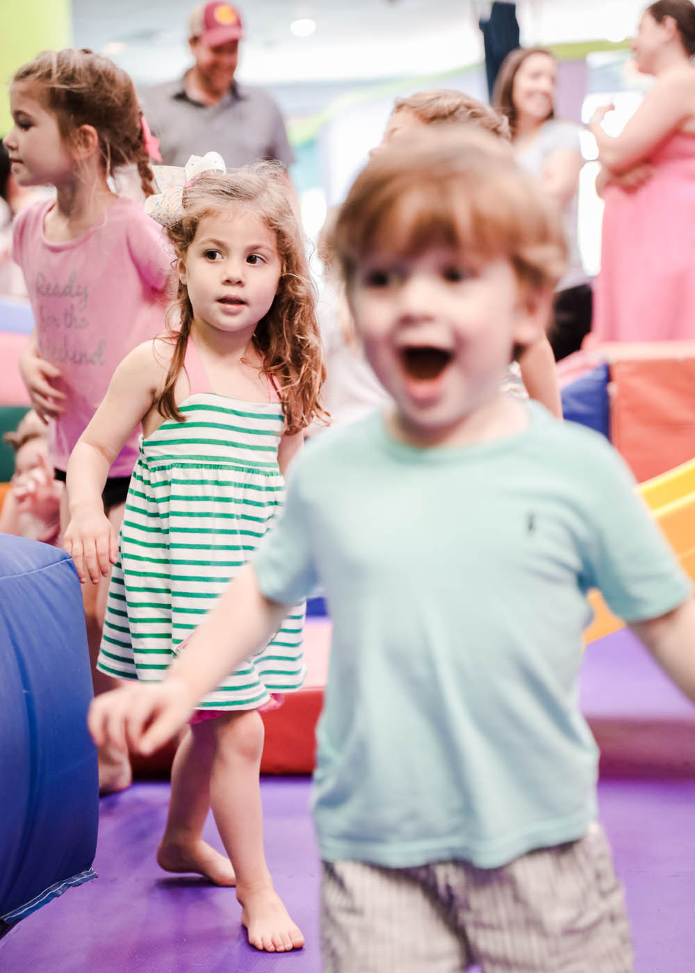 A group of different aged kids at Romp n' Roll at preschool classes.